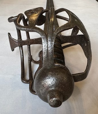 Lot 5 - AN ENGLISH BASKET-HILTED CAVALRY BACKSWORD, MID-18TH CENTURY