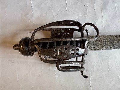 Lot 5 - AN ENGLISH BASKET-HILTED CAVALRY BACKSWORD, MID-18TH CENTURY
