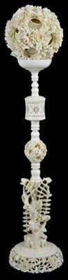 Lot 96 - A CHINESE IVORY PUZZLE BALL ON STAND