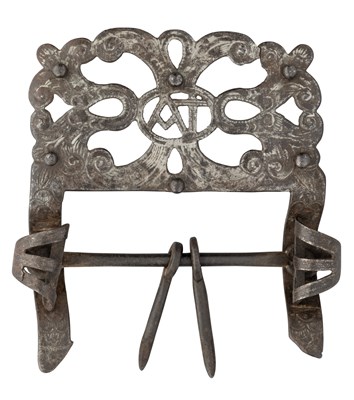 Lot 330 - A DECORATED IRON BUCKLE, LATE 17TH/18TH CENTURY, PROBABLY FROM AN EQUESTRIAN HARNESS AND AN IRON POCKET WARMER, 19TH CENTURY