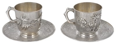 Lot 126 - A PAIR OF CHINESE SILVER CUPS AND SAUCERS