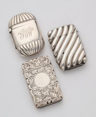 Lot 651 - THREE VICTORIAN SILVER VESTA CASES, 1884-86