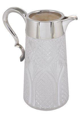 Lot 304 - A VICTORIAN SILVER-MOUNTED WATER JUG