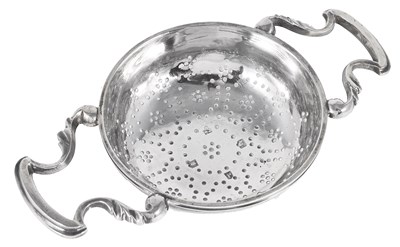 Lot 366 - A GEORGE II SILVER LEMON STRAINER