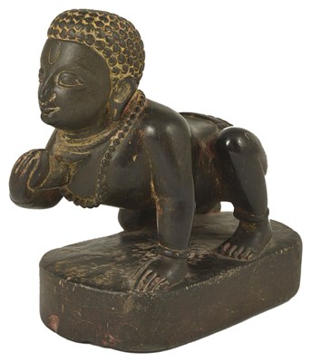 Lot 15 - A DARK GREY STONE FIGURE OF BALAKRISHNA