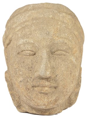 Lot 70 - A SANDSTONE HEAD OF A MONK