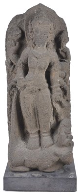 Lot 172 - A JAVANESE VOLCANIC STONE STELE DEPICTING DURGA MAHISASURAMARDINI