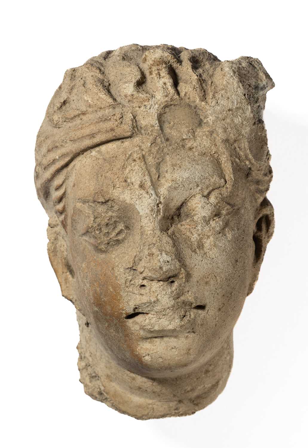 Lot 92 - A GANDHARA STUCCO HEAD OF A DEVOTEE, NORTH-WESTERN PAKISTAN, 4TH/5TH CENTURY