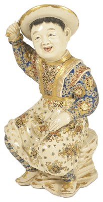 Lot 287 - A JAPANESE SATSUMA FIGURE OF A SMILING BOY