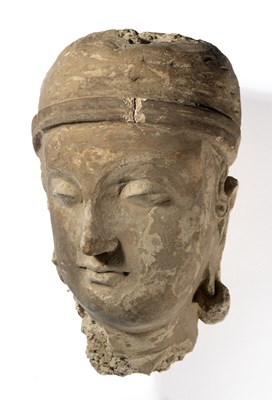 Lot 94 - A GANDHARA  STUCCO HEAD OF A DEVOTEE, NORTH-WESTERN PAKISTAN, 4TH/5TH CENTURY