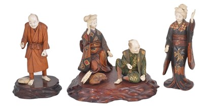 Lot 321 - ~A GROUP OF FOUR JAPANESE LACQUERED WOOD AND IVORY OKIMONO