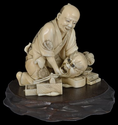 Lot 330 - ~A JAPANESE IVORY OKIMONO OF A CRAFTSMAN