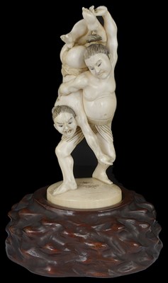 Lot 333 - ~A JAPANESE IVORY OKIMONO OF WRESTLERS