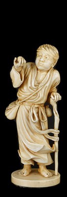 Lot 343 - ~A JAPANESE IVORY OKIMONO OF A YOUNG MAN