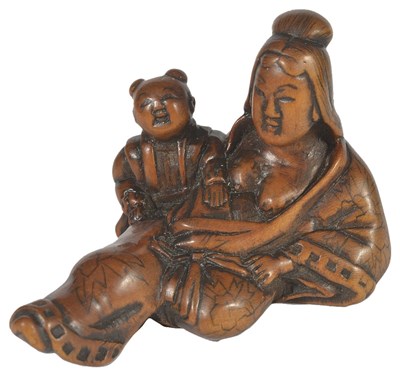 Lot 349 - A JAPANESE WOOD NETSUKE OF A COURTESAN AND BOY