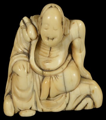 Lot 358 - ~A JAPANESE IVORY TOBORI NETSUKE OF A RAKAN