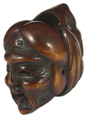 Lot 370 - A JAPANESE WOOD MASK NETSUKE OF JO AND UBA