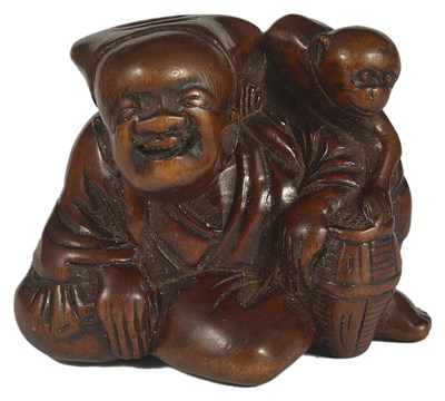 Lot 373 - A JAPANESE WOOD NETSUKE OF A SARUMAWASHI