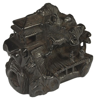 Lot 377 - ~A JAPANESE EBONY NETSUKE OF A MOUNTAIN RETREAT