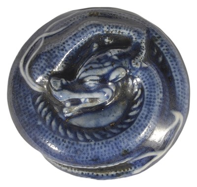 Lot 380 - A JAPANESE BLUE AND WHITE PORCELAIN MANJU NETSUKE OF A DRAGON