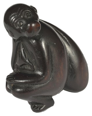 Lot 389 - A JAPANESE WOOD NETSUKE OF A MONKEY WITH SACK OVER ITS SHOULDER