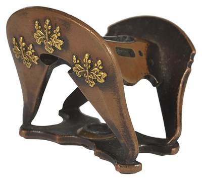 Lot 391 - A JAPANESE COPPER NETSUKE OF A SADDLE