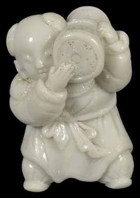 Lot 396 - A JAPANESE HIRADO WHITE PORCELAIN NETSUKE OF A KARAKO