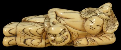 Lot 400 - ~A JAPANESE IVORY NETSUKE OF A BUGAKU DANCER