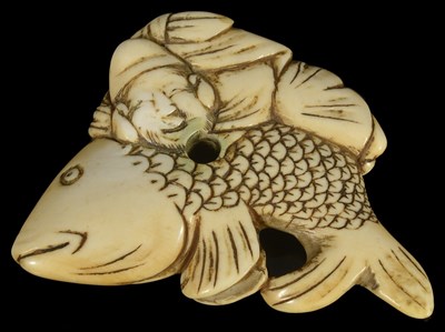 Lot 412 - ~A JAPANESE IVORY NETSUKE OF EBISU