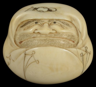 Lot 416 - ~A JAPANESE IVORY NETSUKE OF A DARUMA HAND WARMER