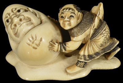 Lot 420 - ~A JAPANESE IVORY NETSUKE OF A KARAKO AND YUKI-DARUMA SNOWBALL