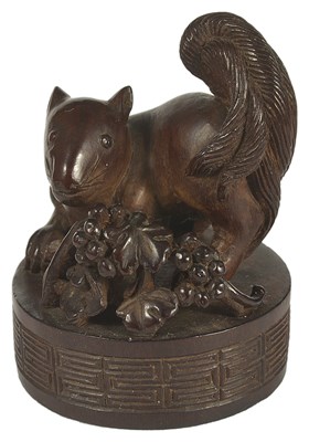 Lot 437 - A JAPANESE WOOD SEAL NETSUKE OF A SQUIRREL