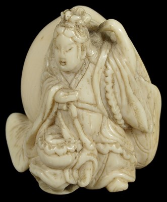 Lot 446 - ~A JAPANESE IVORY NETSUKE OF SEIOBO