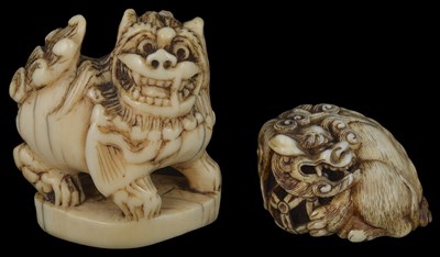 Lot 460 - ~TWO JAPANESE IVORY NETSUKE OF SHISHI