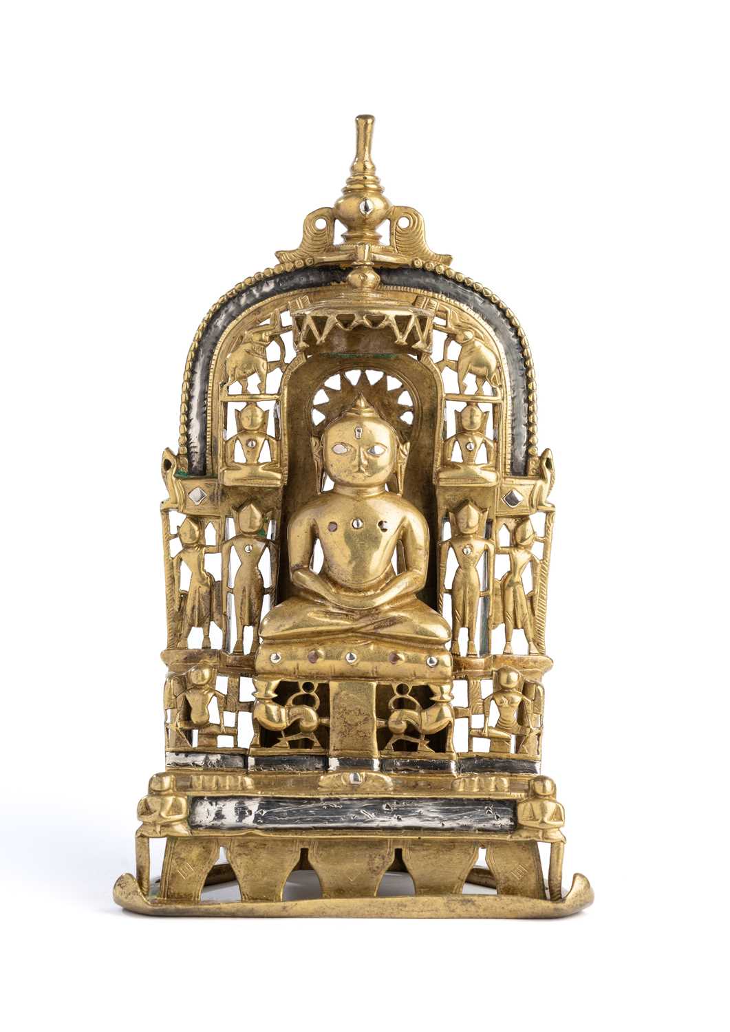 Lot 132 - A JAIN BRASS SHRINE PROBABLY DEPICTING SUMATINATHA, GUJARAT,  INDIA, DATED SAMVAT 1520/1463 AD