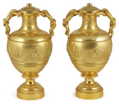 Lot 506 - A PAIR OF GILT-BRONZE URNS