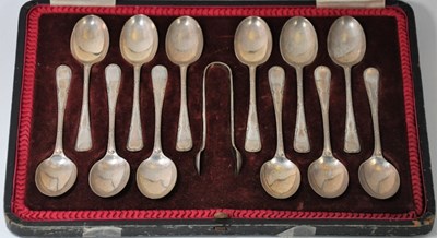 Lot 523 - A CASED SET OF TWELVE GEORGE V SILVER COFFEE SPOONS AND A PAIR OF SUGAR TONGS