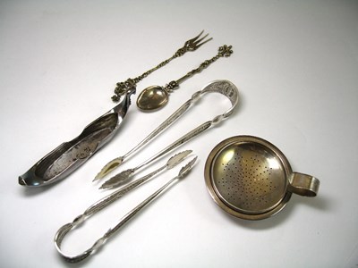 Lot 570 - TWO PAIRS OF SILVER FILIGREE SUGAR TONGS