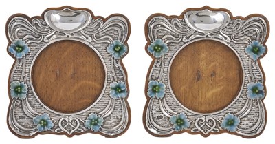 Lot 591 - A NEAR PAIR OF EDWARDIAN SILVER PHOTOGRAPH FRAMES