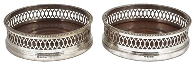 Lot 606 - A PAIR OF SILVER WINE COASTERS