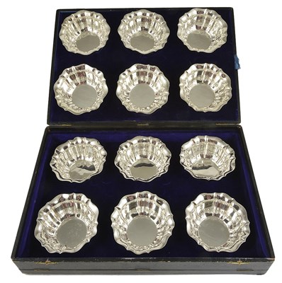 Lot 615 - A SET OF TWELVE SILVER FINGER BOWLS