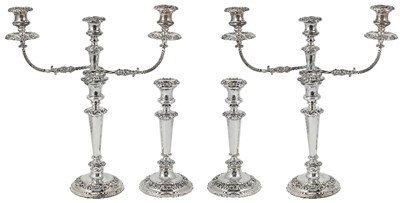 Lot 649 - A SET OF FOUR SILVER CANDLESTICKS AND A PAIR OF SHEFFIELD PLATE CANDELABRA BRANCHES