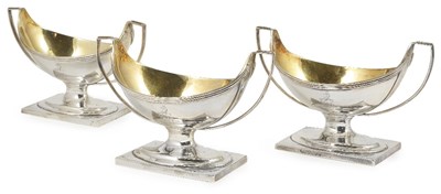 Lot 666 - A SET OF THREE GEORGE III SILVER SALT CELLARS