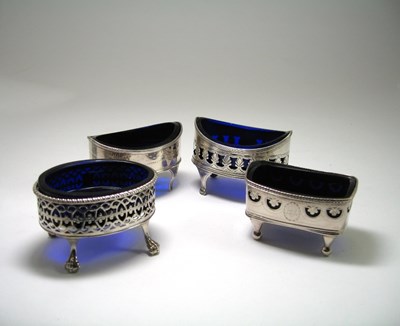 Lot 692 - A COLLECTION OF FOUR GEORGE III SILVER SALT CELLARS