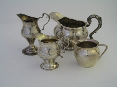 Lot 141 - A WILLIAM IV SILVER MILK JUG