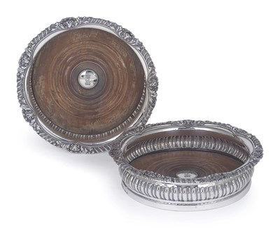 Lot 147 - A PAIR OF GEORGE IV SILVER WINE COASTERS