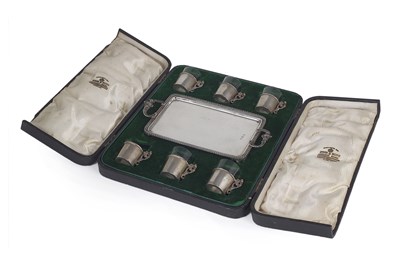 Lot 159 - AN EDWARDIAN SILVER SET OF SIX TODDY HOLDERS AND A TRAY