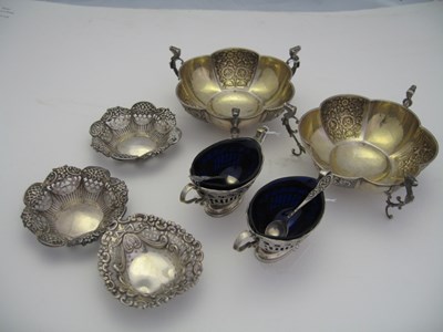 Lot 162 - A PAIR OF SILVER SALT CELLARS WITH SPOONS