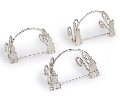 Lot 172 - A SET OF FOUR VICTORIAN SILVER OXFORD THEMED MENU HOLDERS