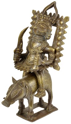 Lot 107 - A BHUTA FIGURE OF A DEITY RIDING A BOAR